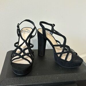 Size 9 black heels. Never been worn